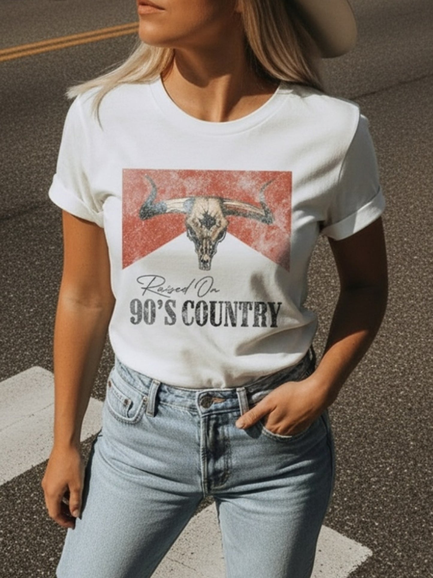Women's Vintage 90s Country T-Shirt - Classic White Women's T-Shirt - Short Sleeve Slim Fit Casual T-Shirt with Iconic Bull Skull Design with the Tagline 'Raised On 90's Country' in Vintage Lettering | Perfect for Western Themed Clothing