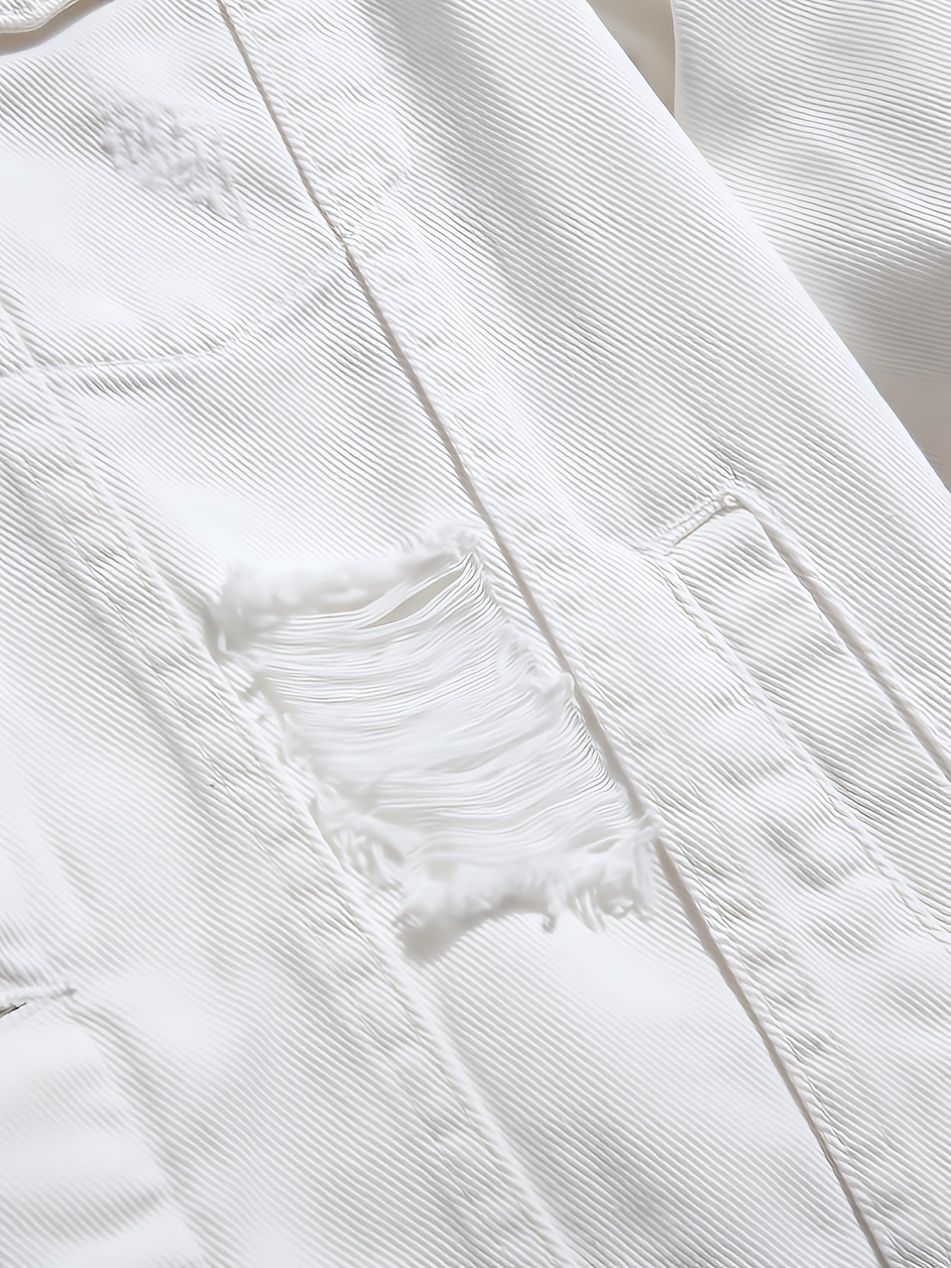 A Straightforward And Stylish Denim Jacket for Men, Featuring a Clean White Minimalist Design, Robust Washed Irregular Perforations, a Relaxed Fit for Added Comfort, a Single-Row Button Closure with an Open Front, And a Trendy, Cool Aesthetic