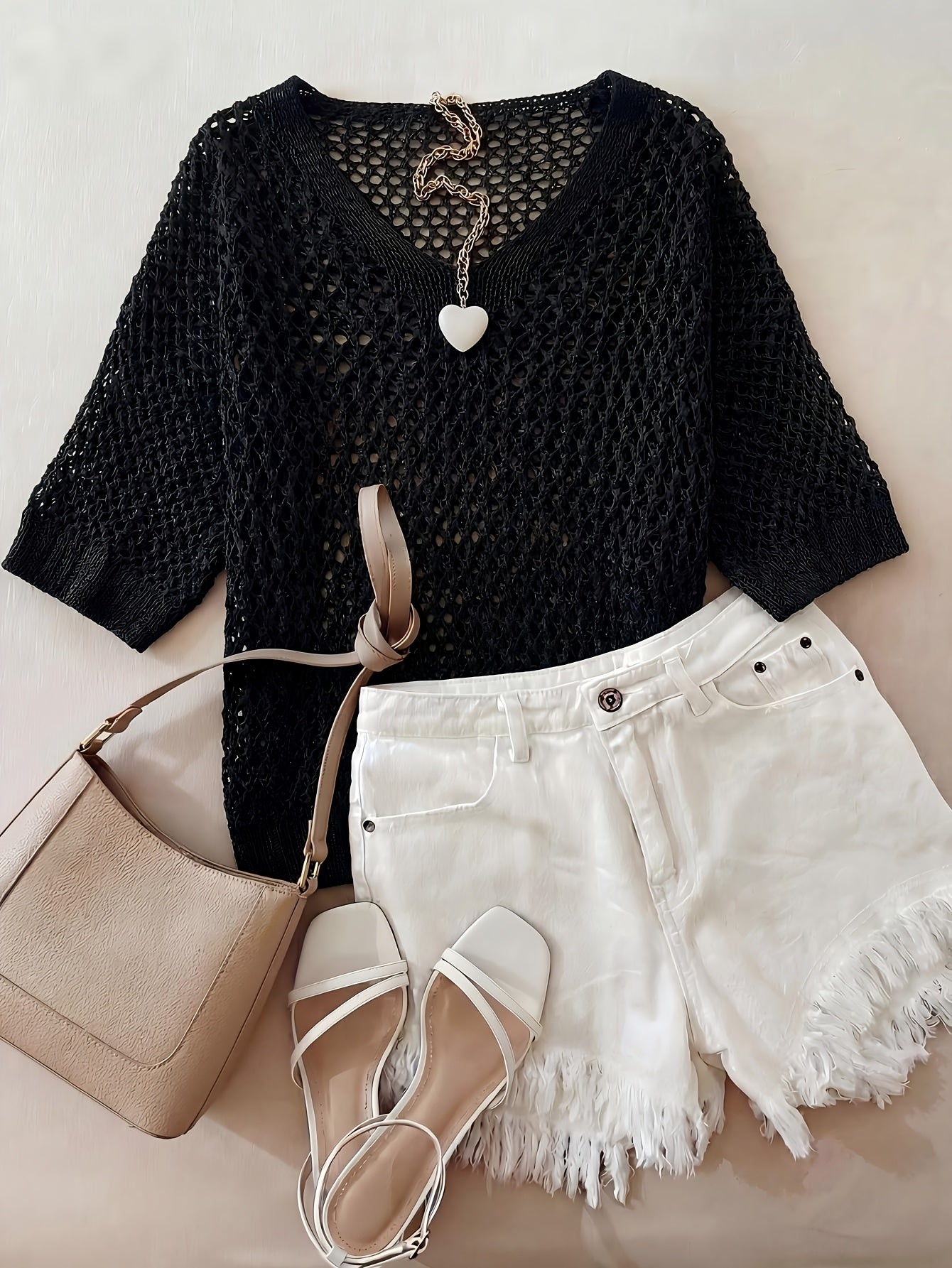 A Stylish Loose-Fitting Top with a Solid Color, V-Neck, And Hollow Design, Featuring Short Sleeves And New.