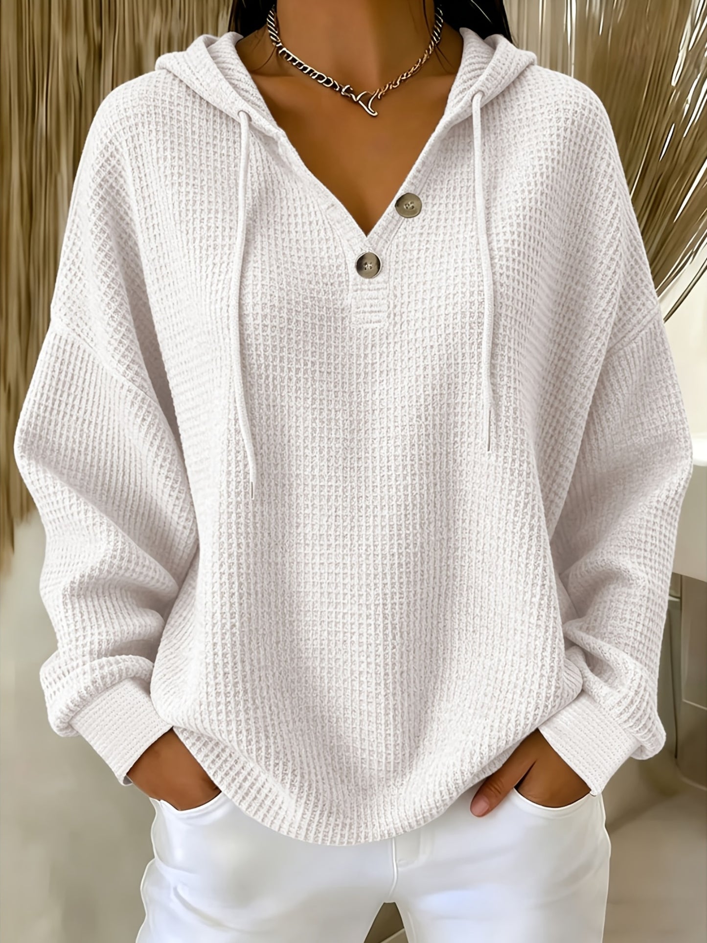 A Plain-Colored Waffle V-Neck Hoodie with Buttons Is Ideal for Everyday Travel