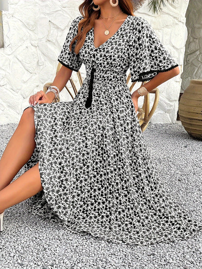 Women's V-neckline Is Elegantly Printed, And The Atmosphere Is Tasseled Dress