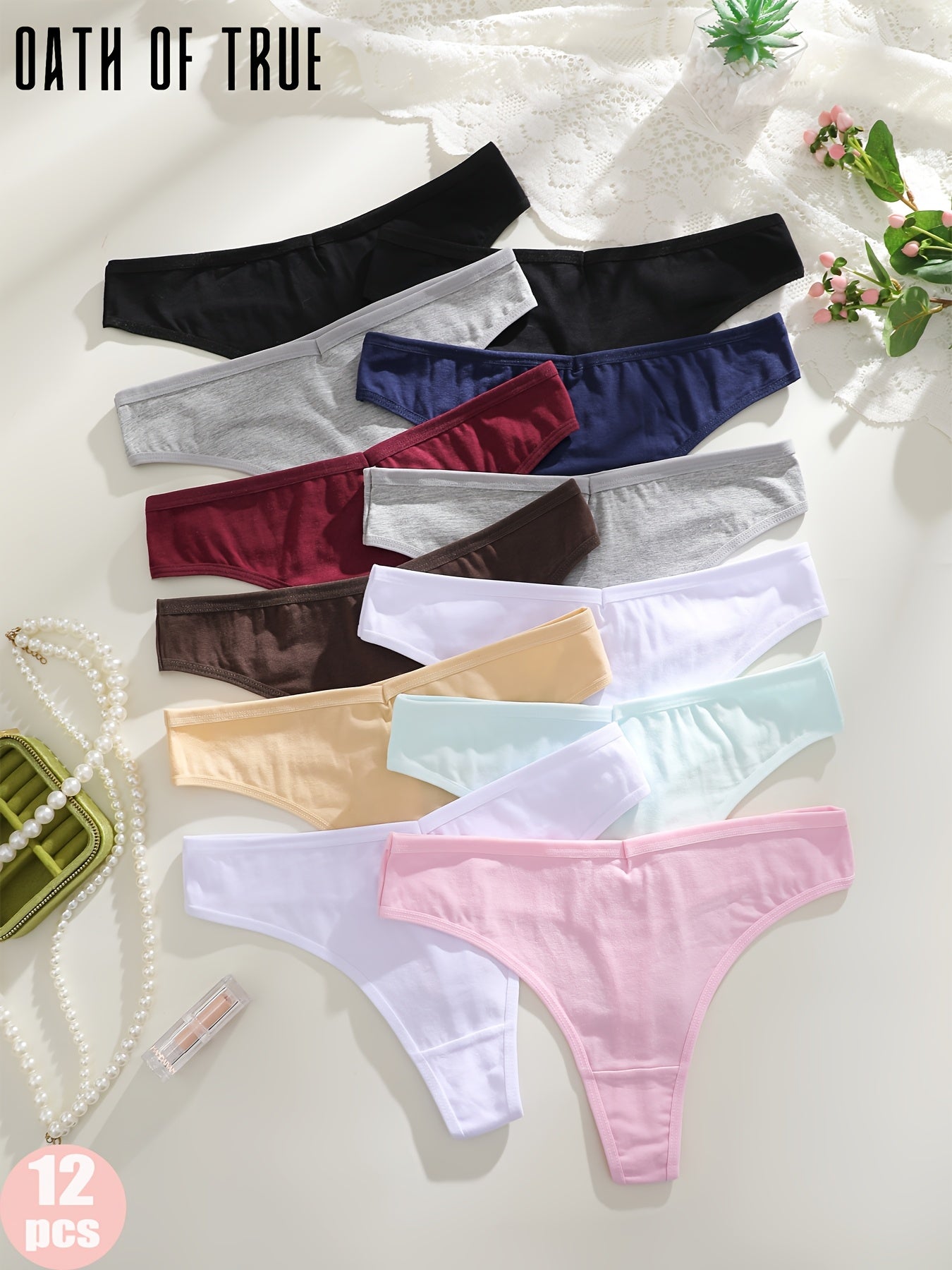 OATH OF TRUE Offers 12 Solid Color Thongs, Available in Black, Dark Blue, Mocha Gray, Gray, Burgundy, Light Beige, White, Pink, And Light Green.