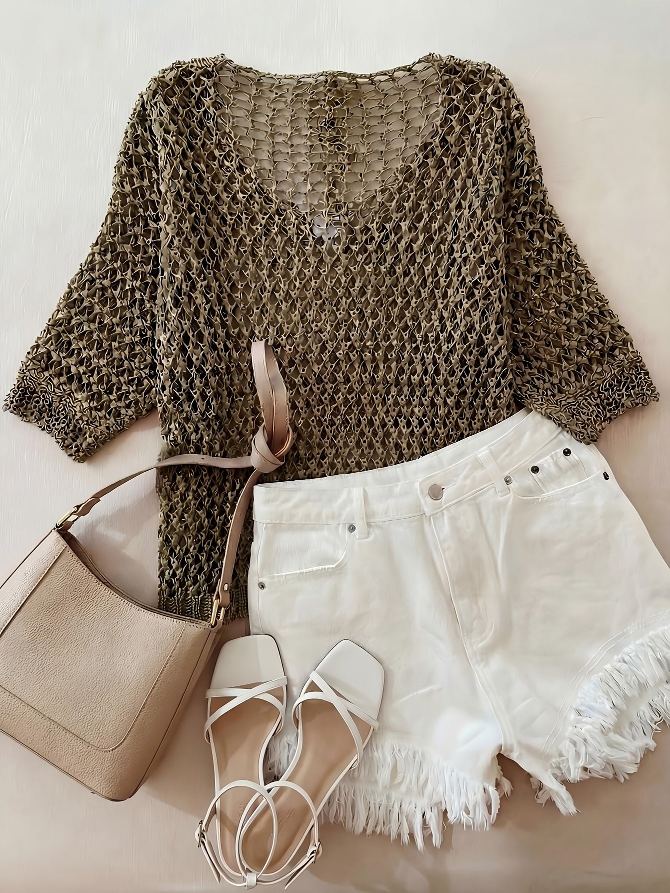 A Stylish Loose-Fitting Top with a Solid Color, V-Neck, And Hollow Design, Featuring Short Sleeves And New.