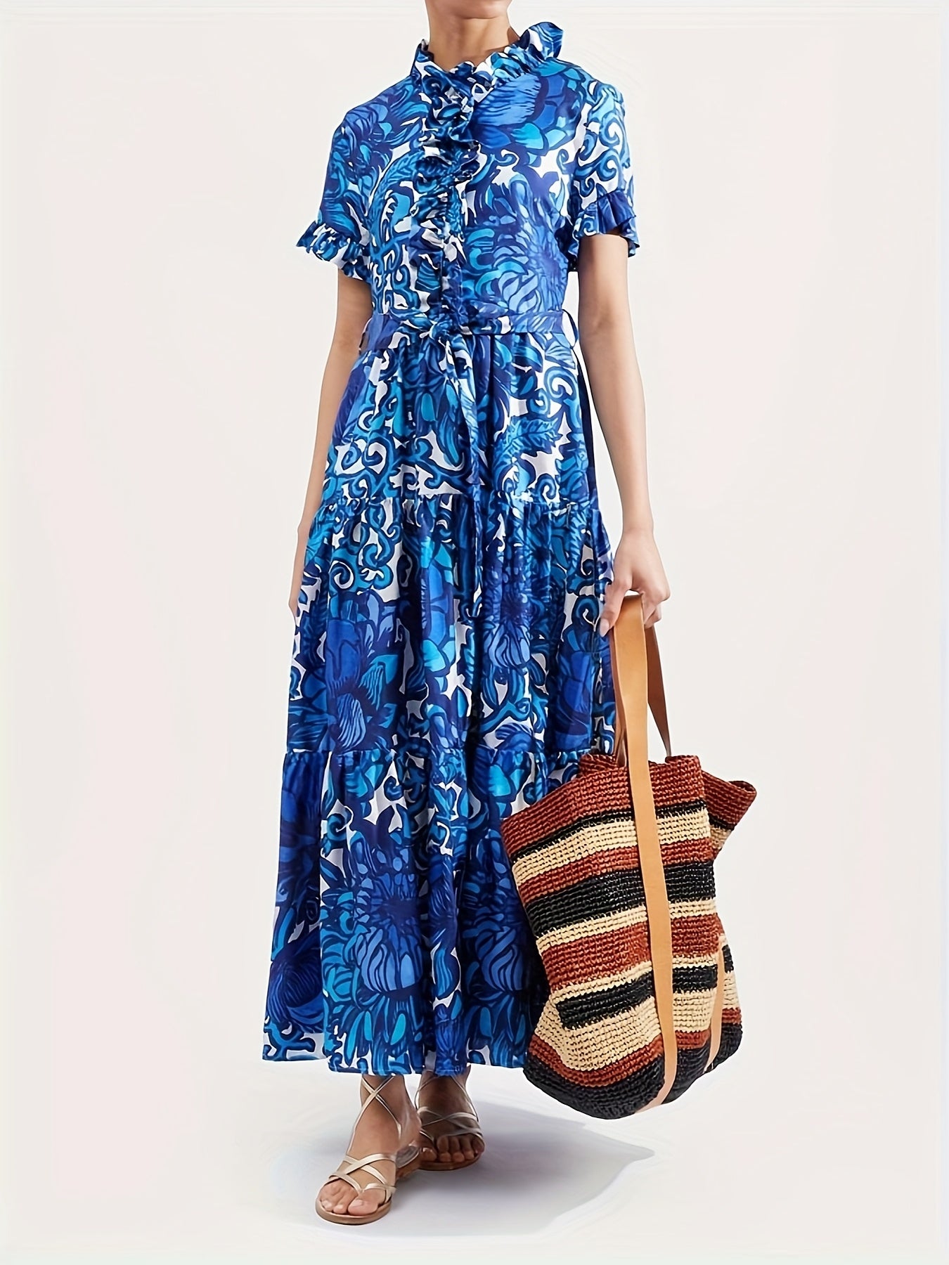 Maxi Dress with a Blue And Yellow Floral Pattern, Featuring Short Sleeves, a Tie Layer, Made from Imitation Tencel Fabric, Adorned with Chest Ruffles, a V-Neck, a Belt, Two Side Pockets, a Tiered Skirt, And a Straight Hem