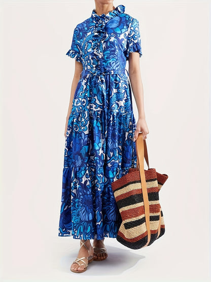 Maxi Dress with a Blue And Yellow Floral Pattern, Featuring Short Sleeves, a Tie Layer, Made from Imitation Tencel Fabric, Adorned with Chest Ruffles, a V-Neck, a Belt, Two Side Pockets, a Tiered Skirt, And a Straight Hem
