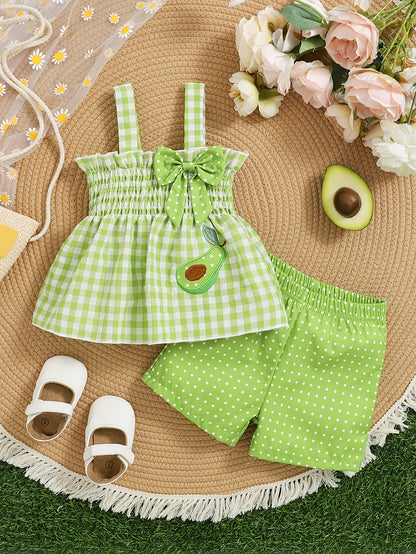 Set of 2 Girls' Outfits for Spring And Summer: a Gingham Dress with a Strawberry Print And Bow, Paired with Red Polka Dot Shorts. This Casual Set Is Machine Washable And Ideal for Toddlers, Featuring a Comfortable Spandex Design, for Outdoor