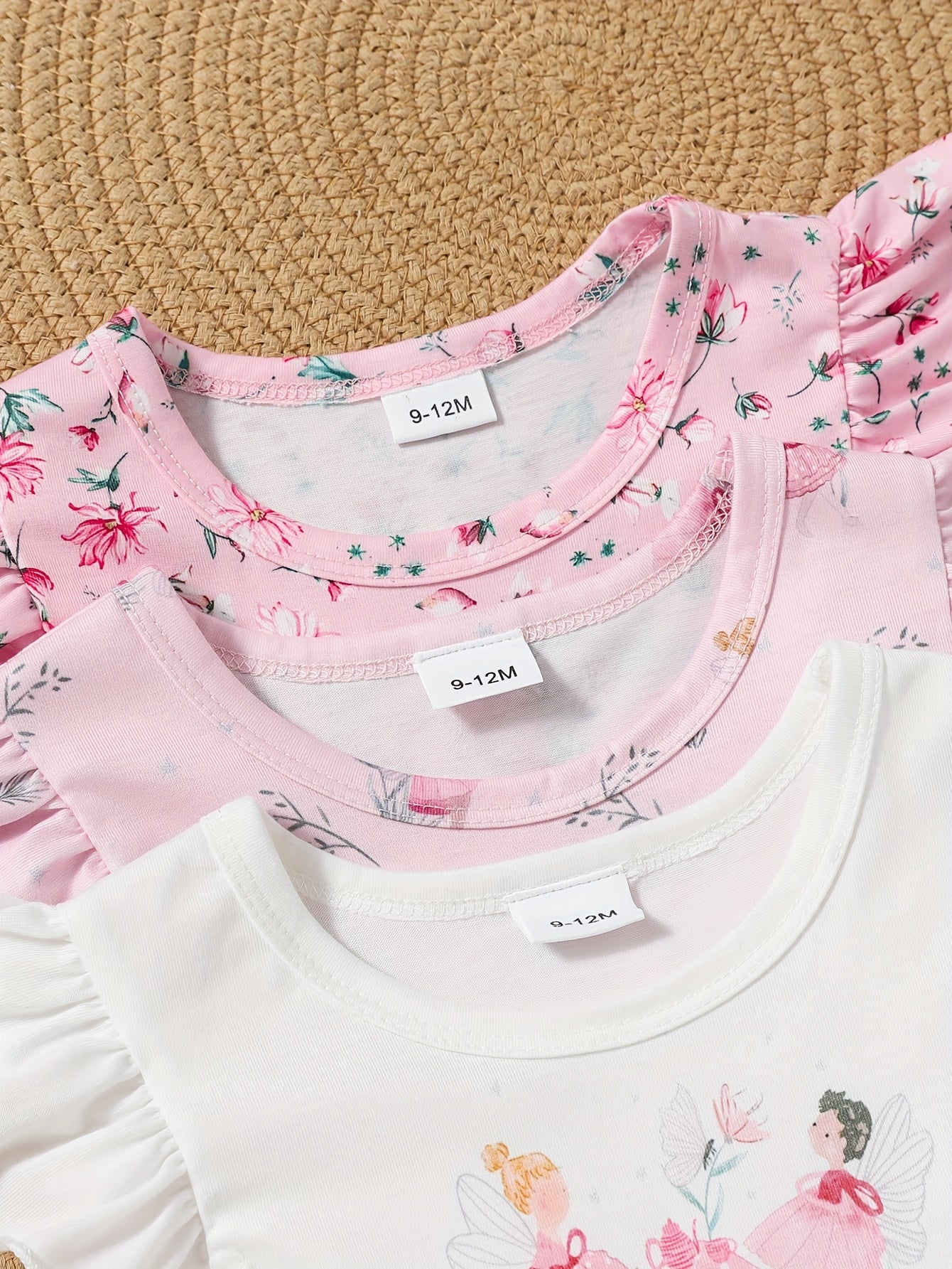 A Cute And Casual Outfit Set for Baby Girls Featuring a Pink Floral Print Dress with Flutter Sleeves, Designed for Spring And Summer.