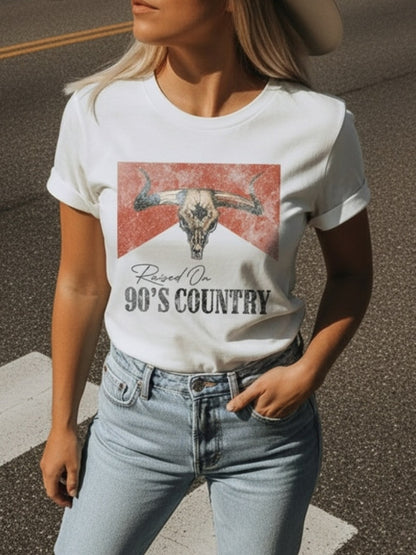 Women's Vintage 90s Country T-Shirt - Classic White Women's T-Shirt - Short Sleeve Slim Fit Casual T-Shirt with Iconic Bull Skull Design with the Tagline 'Raised On 90's Country' in Vintage Lettering | Perfect for Western Themed Clothing