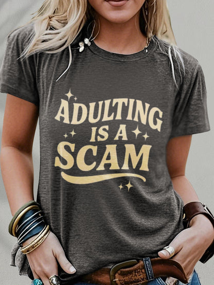 Women's Funny "Blended Adult Is a Scam" T-Shirt - Retro Humorous Slogan Short Sleeve Round Neck Blouse Suitable for Her Gift, Casual Statement Top for Daily Wear & Humor Apparel, Machine Washable Comfortable Everyday Outfits