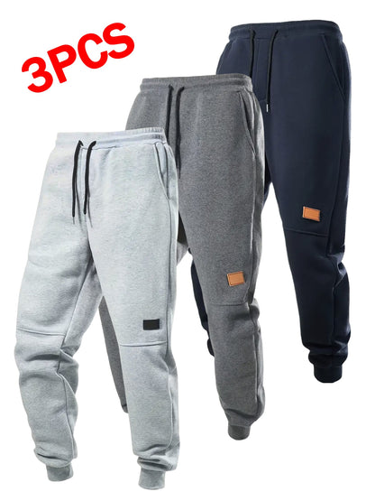 Set of 3 Boys' Warm Fleece Jogger Pants, Suitable for Casual Wear. Available in Black, Gray, Blue, And Dark Gray, These Teenage Activewear Joggers Feature a Drawstring Waistband And Ribbed Cuffs, Ideal for Outdoor Activities