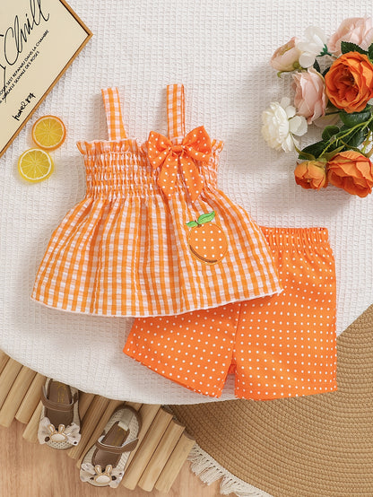 Set of 2 Girls' Outfits for Spring And Summer: a Gingham Dress with a Strawberry Print And Bow, Paired with Red Polka Dot Shorts. This Casual Set Is Machine Washable And Ideal for Toddlers, Featuring a Comfortable Spandex Design, for Outdoor