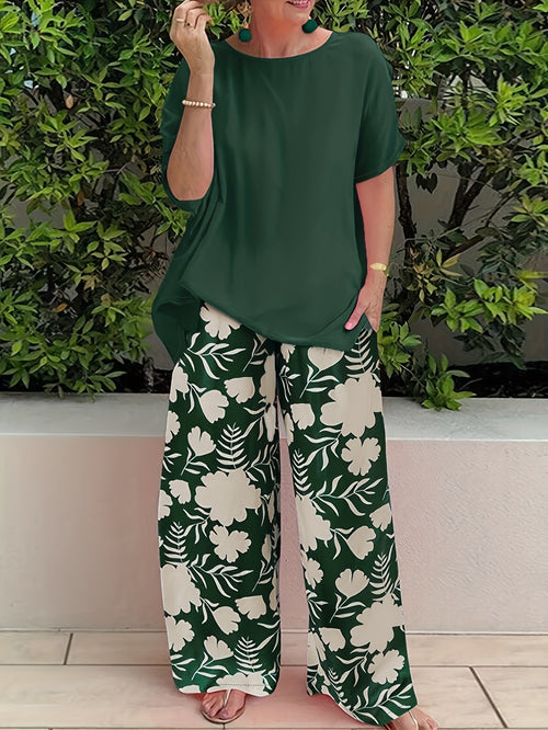 Plus Size Women's Botanical Print Two-Piece Set- Round Neck Tops with Random Floral Print Wide Leg Pants Featuring Pockets, Perfect for Spring and Summer Casual or Stylish Outfits