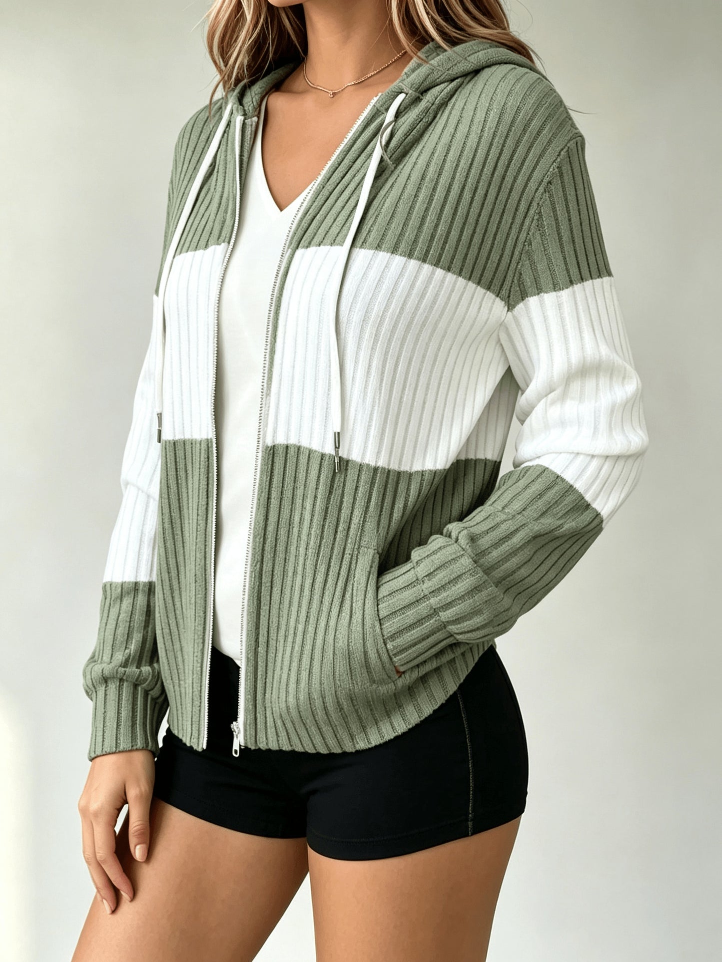 A Hooded Cardigan with Color Blocks Is Essential for And Office Employees When They Are Out And about Or Visiting Cafes in Their Everyday Lives. It Is Lightweight, Flexible, And Can Be Washed in a Machine, Making It a Vital Piece for Spring, Fall