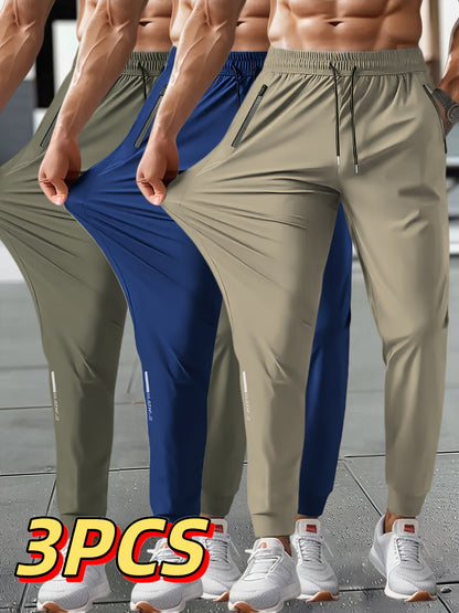 3pcs Men's Summer Solid Color Tapered Sports Pants, High Stretch Fiber, with Ribbed CuffDesign, Nylon 80%Spandex 20%, Reflective Stripe Design At The Hem Of Pants, Regular Fit with ZipperPockets, Breathable ComfortableRunningTraining LongTrousers