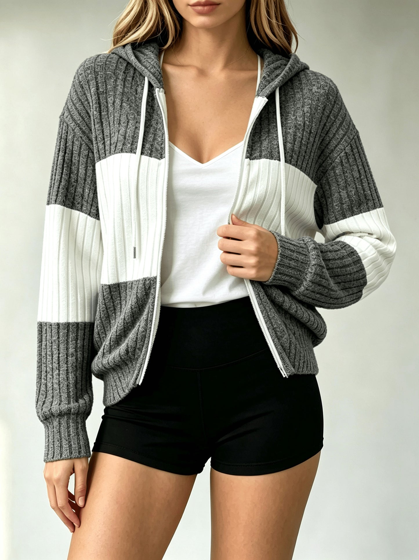 A Hooded Cardigan with Color Blocks Is Essential for And Office Employees When They Are Out And about Or Visiting Cafes in Their Everyday Lives. It Is Lightweight, Flexible, And Can Be Washed in a Machine, Making It a Vital Piece for Spring, Fall