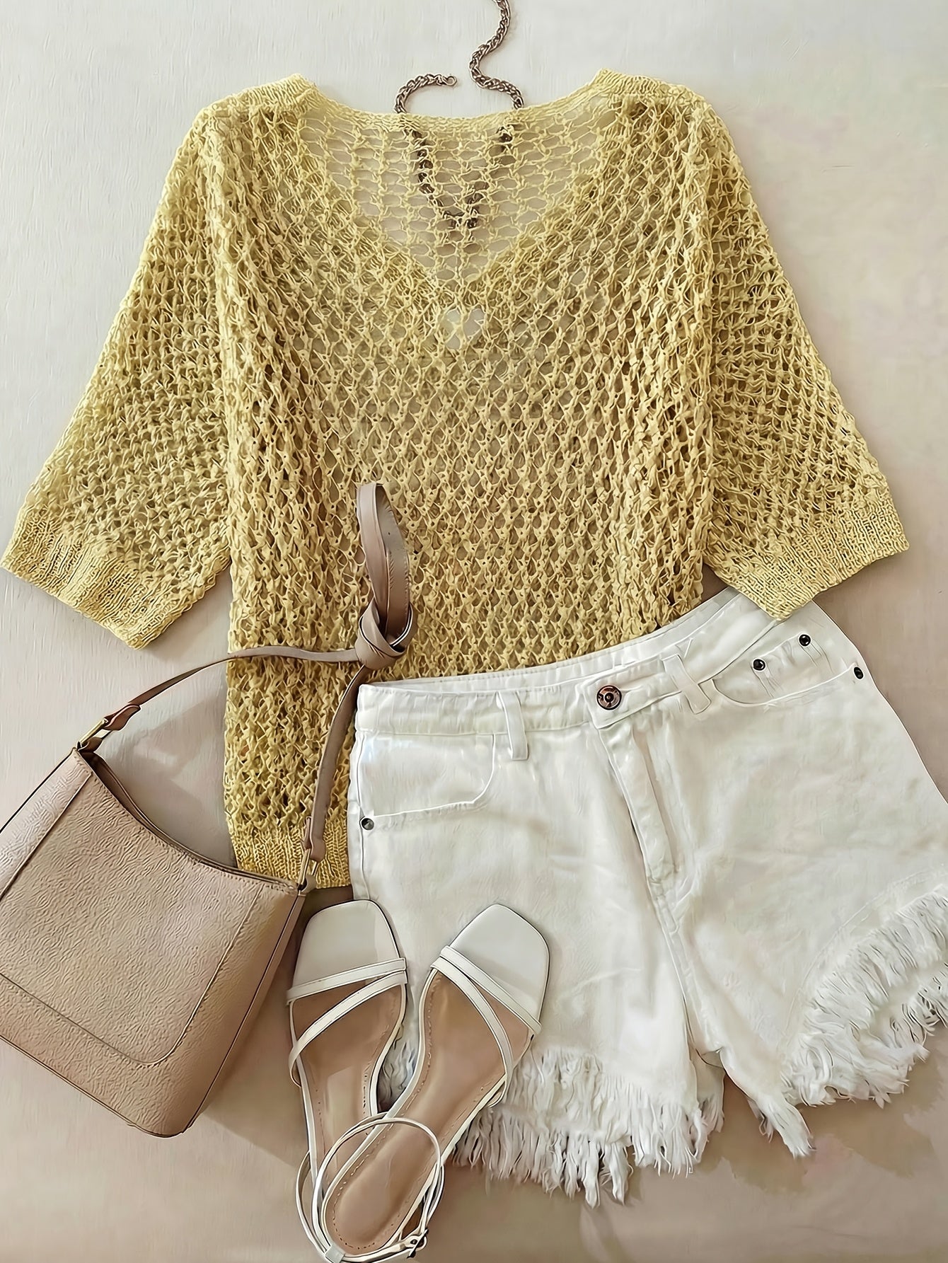 A Stylish Loose-Fitting Top with a Solid Color, V-Neck, And Hollow Design, Featuring Short Sleeves And New.