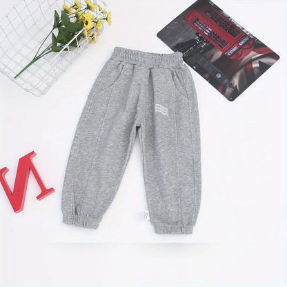 Wwowoniao Boys' Relaxed Fit Jogger Pants Made from a Featuring an Alphabet Design, Slightly Stretchy Knit Material, Equipped with Pockets, Suitable for Spring And Fall, Composed of 58% And 42% Polyester, Ideal for Outdoor Activities