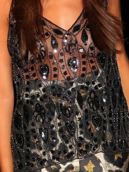 A Halter Top Adorned with Sequins And Beads, Combined with a Sleek And Flattering Short V-Neck Vest, Radiates a Charming And Elegant Femininity