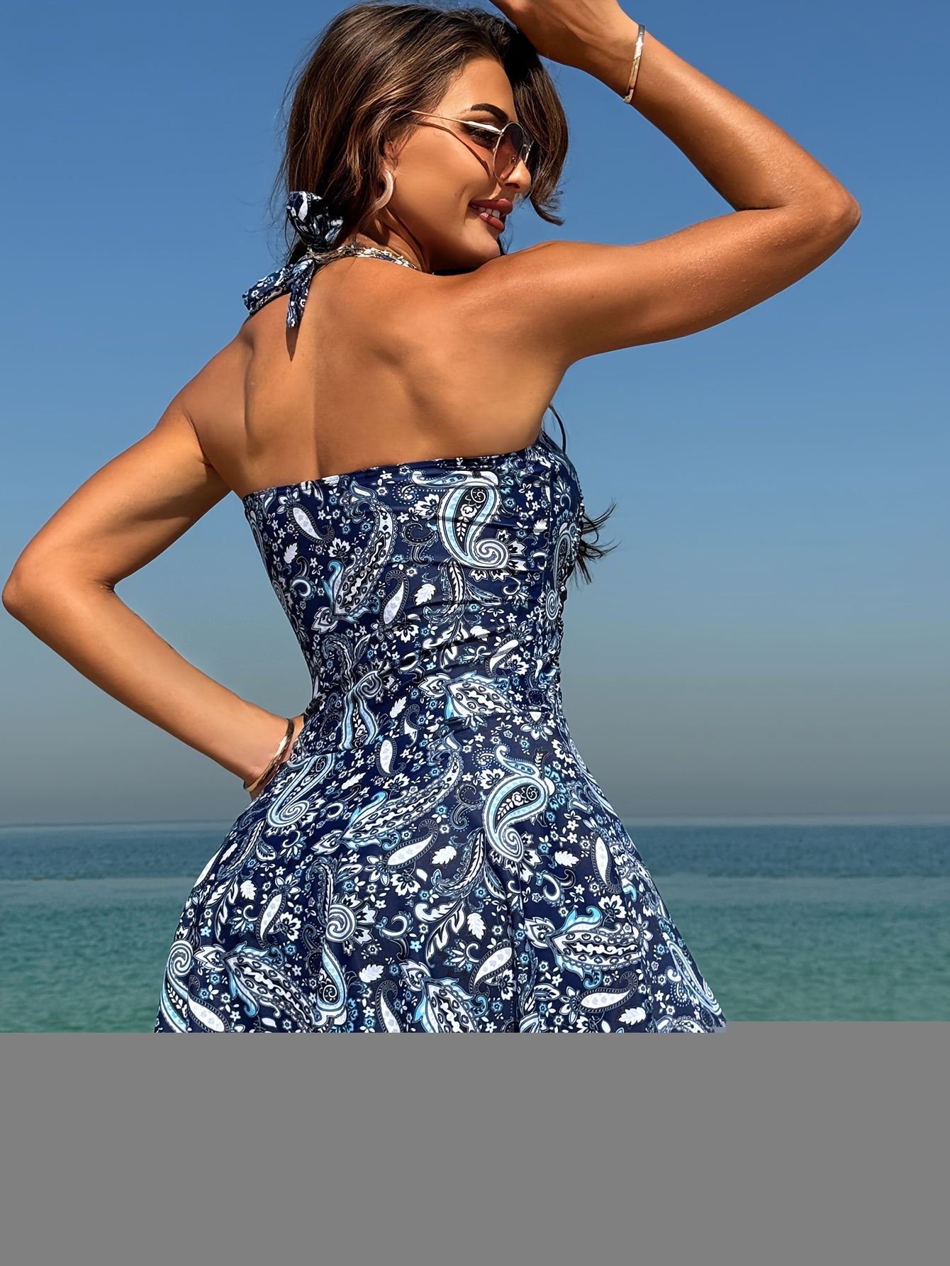 Split Ethnic Style Cashew Flower Top with Side Pleats And Stitching, Draped Pleated Ruffles At The Hem, And Pants In Plain Blue Briefs. Split Tankini