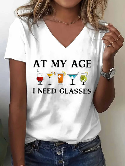 Women'S Funny "At My Age I Need Glasses" Graphic T-Shirt - White V-Neck Tee with Wine Glasses Design - Casual Everyday & Halloween Party Outfit - Standard Size Women'S Top for Mature Humor Lovers, Funny T Shirts, Humorous Clothing, Playful Design, Comfort