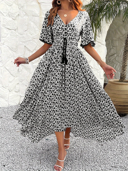 Women's V-neckline Is Elegantly Printed, And The Atmosphere Is Tasseled Dress