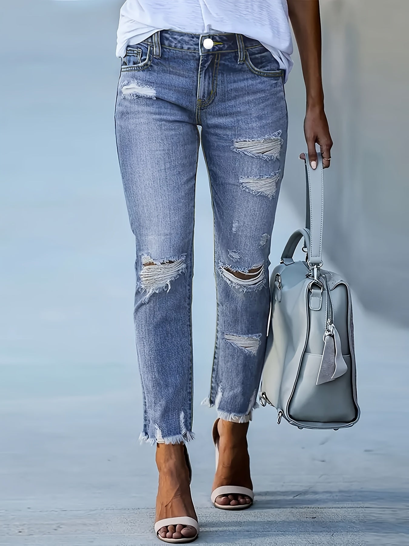 Plus Size Women's Blue Distressed Washed Denim Jeans | Multiple Rips & Destroyed Hem | Slim Fit, Unique Design | Versatile Stylish Style for All-Season Commuting