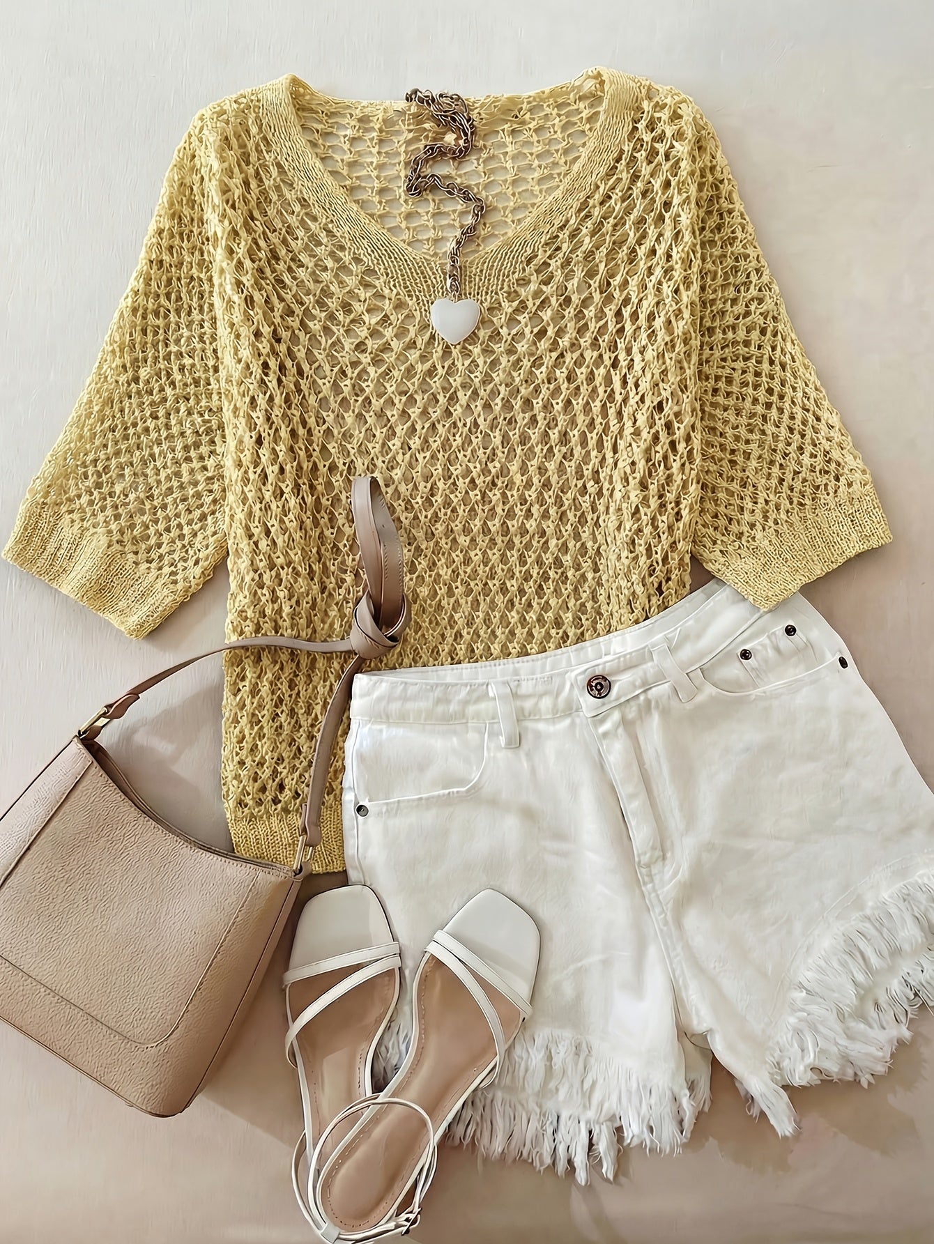 A Stylish Loose-Fitting Top with a Solid Color, V-Neck, And Hollow Design, Featuring Short Sleeves And New.