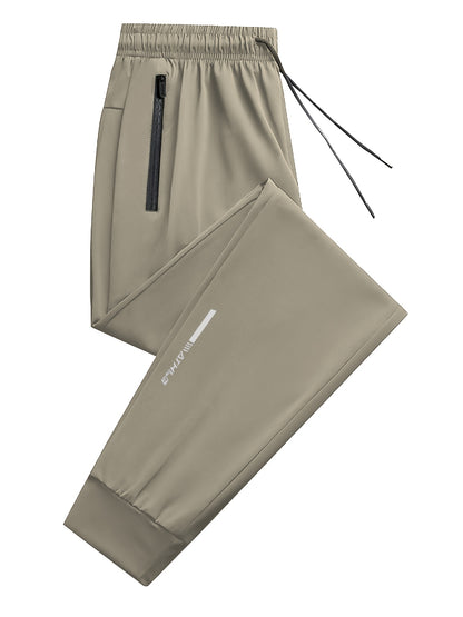 3pcs Men's Summer Solid Color Tapered Sports Pants, High Stretch Fiber, with Ribbed CuffDesign, Nylon 80%Spandex 20%, Reflective Stripe Design At The Hem Of Pants, Regular Fit with ZipperPockets, Breathable ComfortableRunningTraining LongTrousers