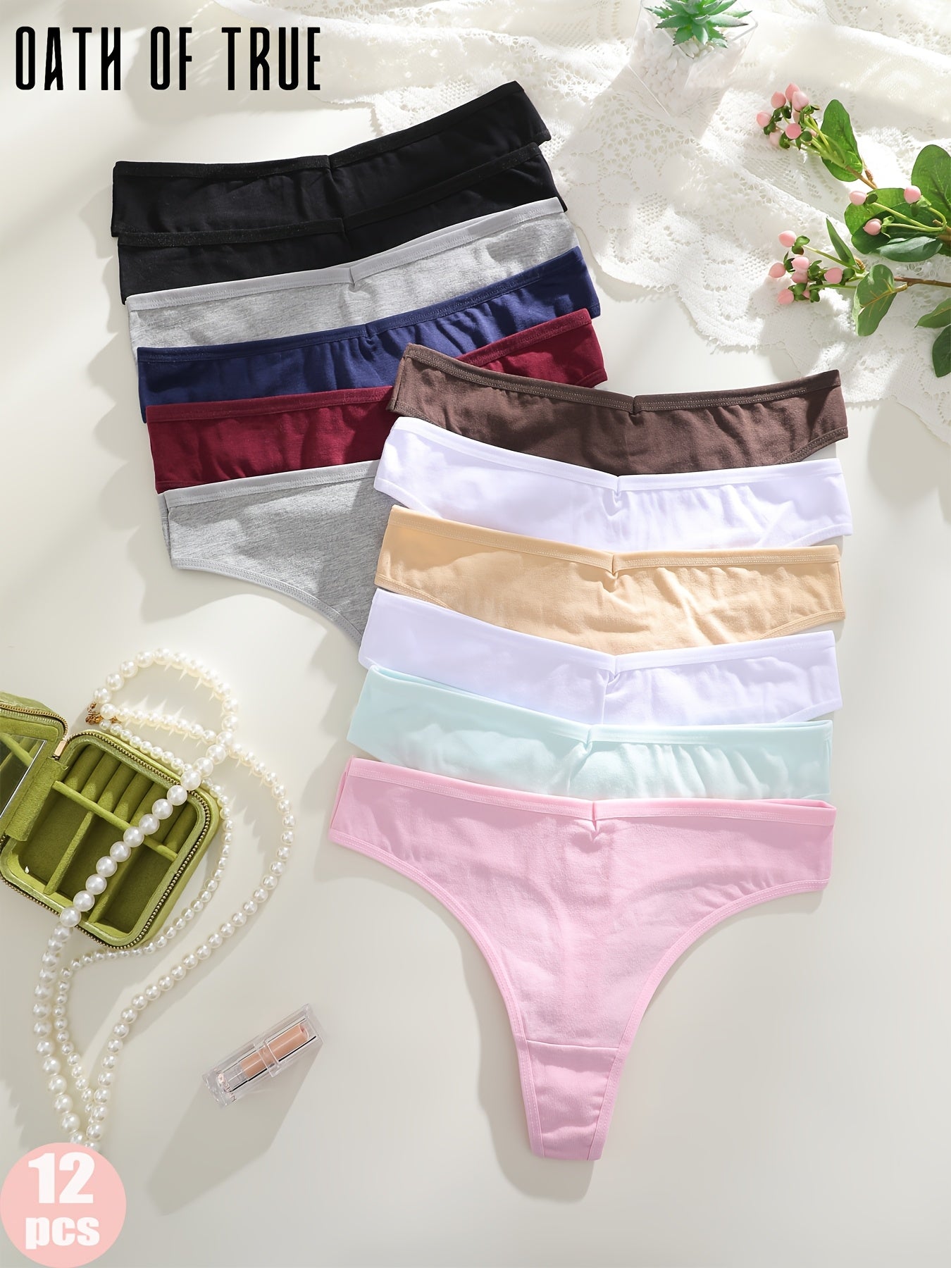 OATH OF TRUE Offers 12 Solid Color Thongs, Available in Black, Dark Blue, Mocha Gray, Gray, Burgundy, Light Beige, White, Pink, And Light Green.