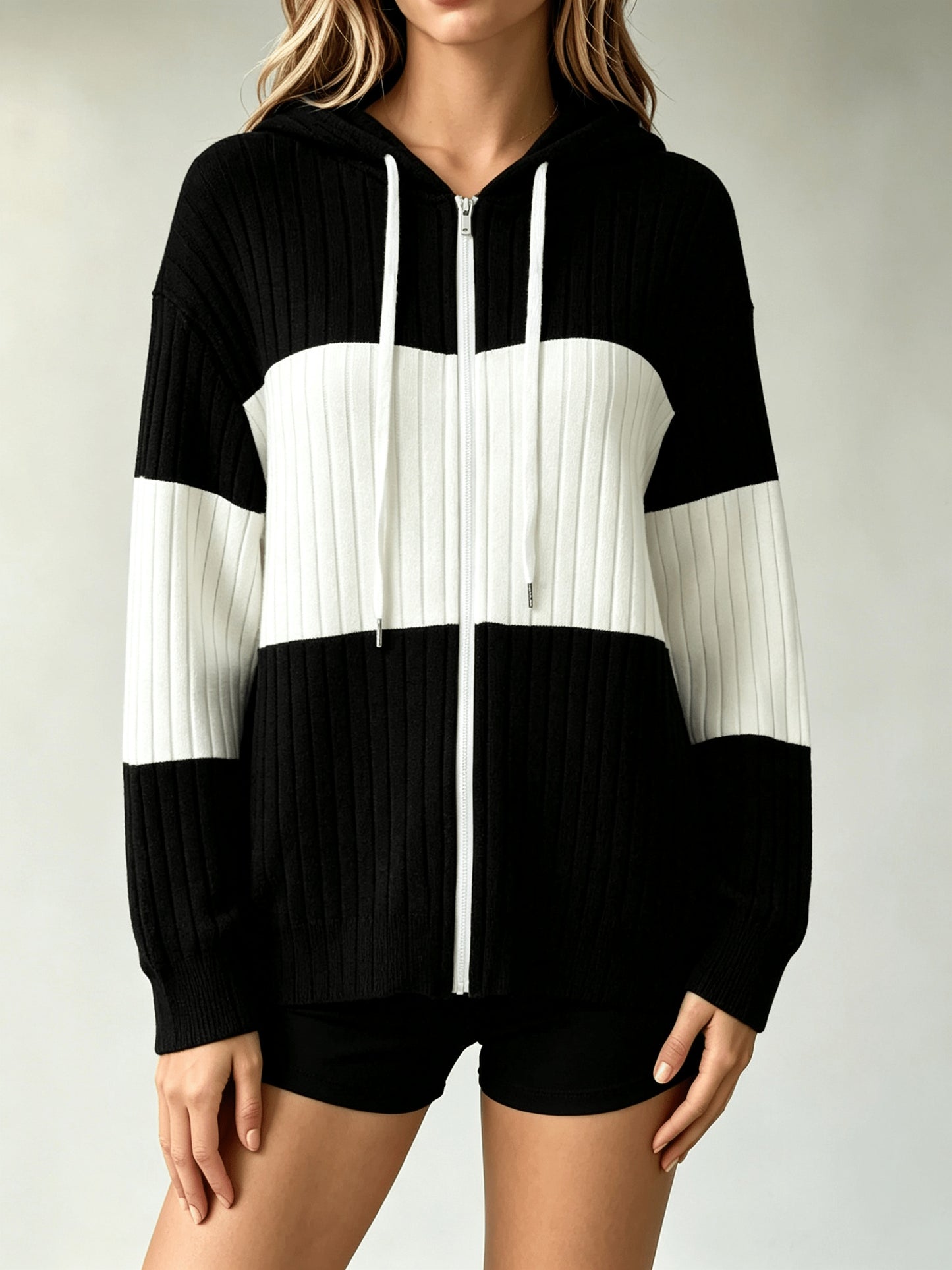 A Hooded Cardigan with Color Blocks Is Essential for And Office Employees When They Are Out And about Or Visiting Cafes in Their Everyday Lives. It Is Lightweight, Flexible, And Can Be Washed in a Machine, Making It a Vital Piece for Spring, Fall