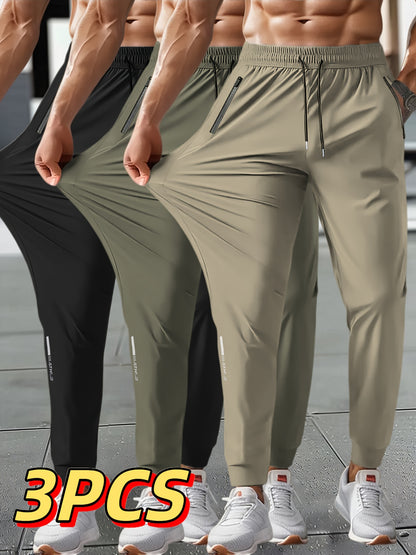 3pcs Men's Summer Solid Color Tapered Sports Pants, High Stretch Fiber, with Ribbed CuffDesign, Nylon 80%Spandex 20%, Reflective Stripe Design At The Hem Of Pants, Regular Fit with ZipperPockets, Breathable ComfortableRunningTraining LongTrousers