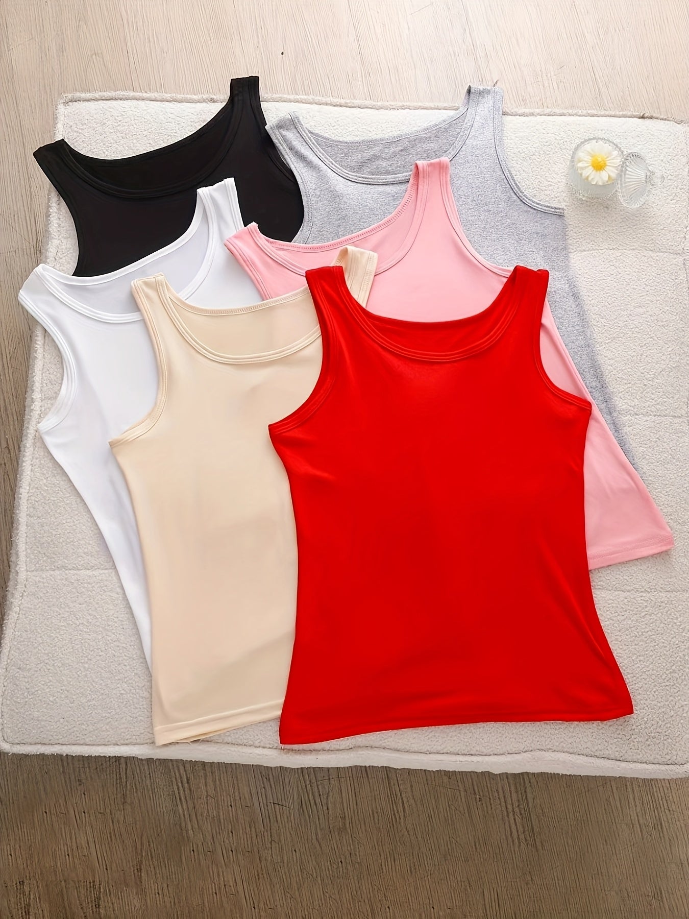 A Set of Six Women'S Soft Adhesive Vests in Various Colors Including Black, White, Gray, Pink, Rose Red, And Green. These Sleeveless Shirts Are Elastic, Breathable, And Comfortable for All Seasons, Making Them Ideal for Home And Casual Outings